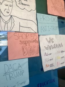 Shop 55 posters created by Oakland High students to show support for immigrant communities.