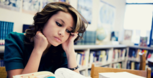 A student studies in a school library.